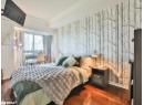 Bedroom featuring baseboards and wood finished floors