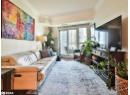 Living area featuring ornamental molding and wood finished floors