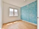 Spare room with light wood-type flooring and wallpapered walls