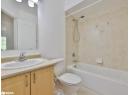 Full bath featuring bathtub / shower combination, vanity, and tile patterned flooring