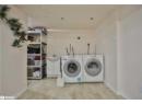 Laundry room featuring washing machine and clothes dryer and cabinet space