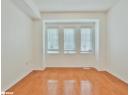 Spare room with light wood-style flooring and baseboards