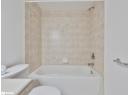 Full bathroom with shower / bath combination and vanity