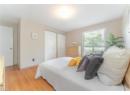 Bedroom featuring light wood-style floors and baseboards