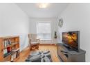 Living area with light wood-style floors and baseboards