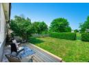 Fenced backyard with a deck