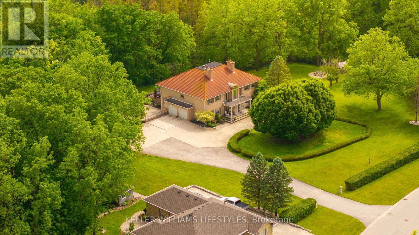 262  Pinetree Lane  Strathroy-Caradoc (NE), Ontario Built without compromise, this estate-worthy Strathroy residence delivers nearly 8,000 sq. ft. of finished living space on approximately 1.5 manicured acres. Set in a private enclave backing onto conservation lands, it offers scale, privacy, and sophistication while remaining just minutes from London with quick 402/401 access.The Georgian-inspired exterior opens to a soaring foyer that floods the home with natural light and sweeping views. A chef's kitchen with granite surfaces, premium cabinetry, and high-end appliances anchors the main level, flowing seamlessly into a casual 4 season sunroom flooded with light and gorgeous views of the rear forests with walkout access to an expansive rear deck. Formal living and dining rooms, a games room, and an executive office or main floor bedroom add balance and function. With five large bedrooms (most with ensuite privileges), six baths, dual staircases, and multiple living areas including a fully finished lower level with media centre, custom bar, gym, and secondary office with kitchenette this property is uniquely suited for multi-generational living, creating accessory dwelling units for income or to simply enjoy the space all to yourself! Whether accommodating extended family, creating a private in-law suite, or exploring a secondary unit to offset carrying costs, the home offers unmatched flexibility. This property delivers a rare combination: estate living in a country setting without sacrificing urban convenience. List of improvements available upon request, as well as potential grants available for creating ADU/SDUs in Strathroy-Caradoc. (id:48254)
