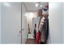 Spacious closet featuring dark wood-style floors and washer / clothes dryer