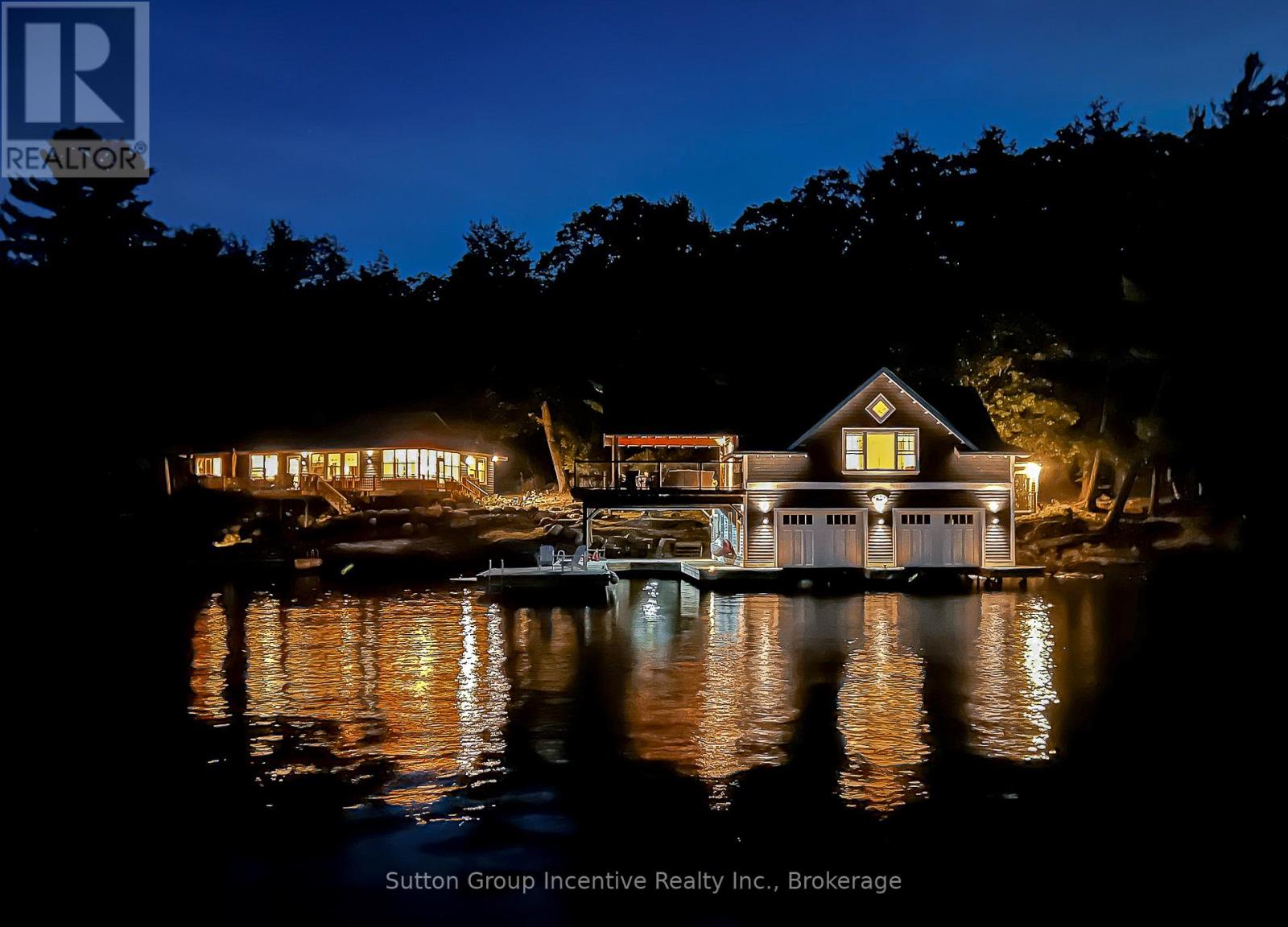 Licenced Short Term Rental on Lake Rosseau in Muskoka, a 5-minute boat ride from the marina to your private Island property. Weekly Rental Cost: $9,988 or $1,426 per night + HST. Main Cottage + boathouse is available in July 2026, water access only. Enjoy your private rental on the Famous OUNO island on Rosseau Lake in Muskoka, with 390 feet of frontage and multiple living spaces, it is a perfect fit for a large group. Launch your boat at Cleveland House Marina near the JW Marriott, where you will have a reserved mainland boat slip and parking space for two. You will be able to arrive at your property with ease. The deep-water access and a covered boat slip are easily navigable by day or night. The property is located on the leeward (less windy) side of the prestigious island, only 5 minutes from the small marina with shops, amenities and gas. Get all-day sunshine and use all the Docks and Decks. The Main Cottage, Boathouse, Guest Bunkie, and Firepit are yours to use. The Main Cottage has three bedrooms and two baths with a living and dining room area with a full kitchen and pantry. The Boathouse has one bedroom with a King Bed and full lake view, one three-piece bathroom, a Den with a Double Bed with no window, a bunkie with a double bed and a lake view front porch. The boathouse has an entertainer kitchenette with a large dining island, a microwave, a toaster oven, an induction hot plate, and several small appliances. The open-concept living room has the best long lake view for soul-inspiring sunrises. The boat house features a 650 sq ft. viewing deck and is partially covered, offering an outdoor living space with BBQ/Blackstone Grill at both the Boathouse and Main Cottage. Efficient A/C system. This property is Pet-friendly with luxury finishes. Maximum of 10 people; this is a weekly rental available in July only. Sq footage includes Bunkie. Professional cleaning services are available but not included. (id:48254)