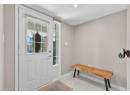 Doorway featuring tile patterned flooring and recessed lighting