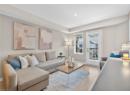 Living room with light wood-style floors and recessed lighting