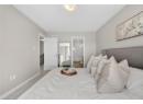 Bedroom with carpet and ensuite bathroom