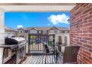 Balcony with area for grilling and a residential view