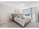 Bedroom with carpet and a textured ceiling
