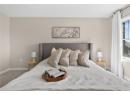 Carpeted bedroom with baseboards