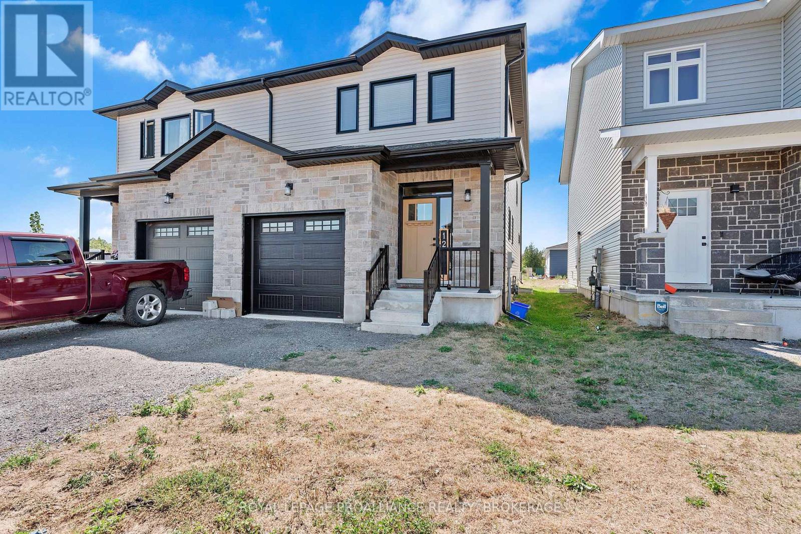 <div class="slider-price">$549,900</div><p>12 Dusenbury Crescent, Loyalist, Ontario</p>