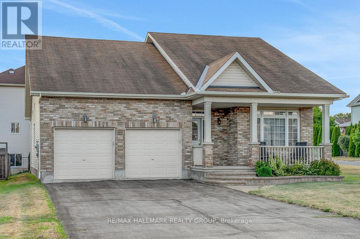 Fabulous opportunity to purchase a 3bed/3bath Bungalow with double-car garage in the heart of Morris Village. Located on a corner lot (Quartz Ave at Crystal Ct), the property features hardwood floors throughout living and dining area. Vaulted ceilings and loads of natural light. Kitchen with plenty of wood cabinetry including pantry, breakfast bar, pendant lighting, stainless steel appliances. Eat-in kitchen space with access to rear yard. Open-concept family room off the kitchen features cozy gas fireplace.  Large primary bedroom with hardwood floors, walk-in-closet, and 4pc ensuite. Second good-sized bedroom, full bathroom, and main level laundry completes the level.  Fully-finished basement includes bedroom, large rec room, den area, powder room. Pot-lights throughout. Good amount of storage space in the utility room.  Fully-fenced backyard has a deck, nat-gas BBQ hookup. Lots of green space.  Storage shed. This home will not disappoint. (id:48254)