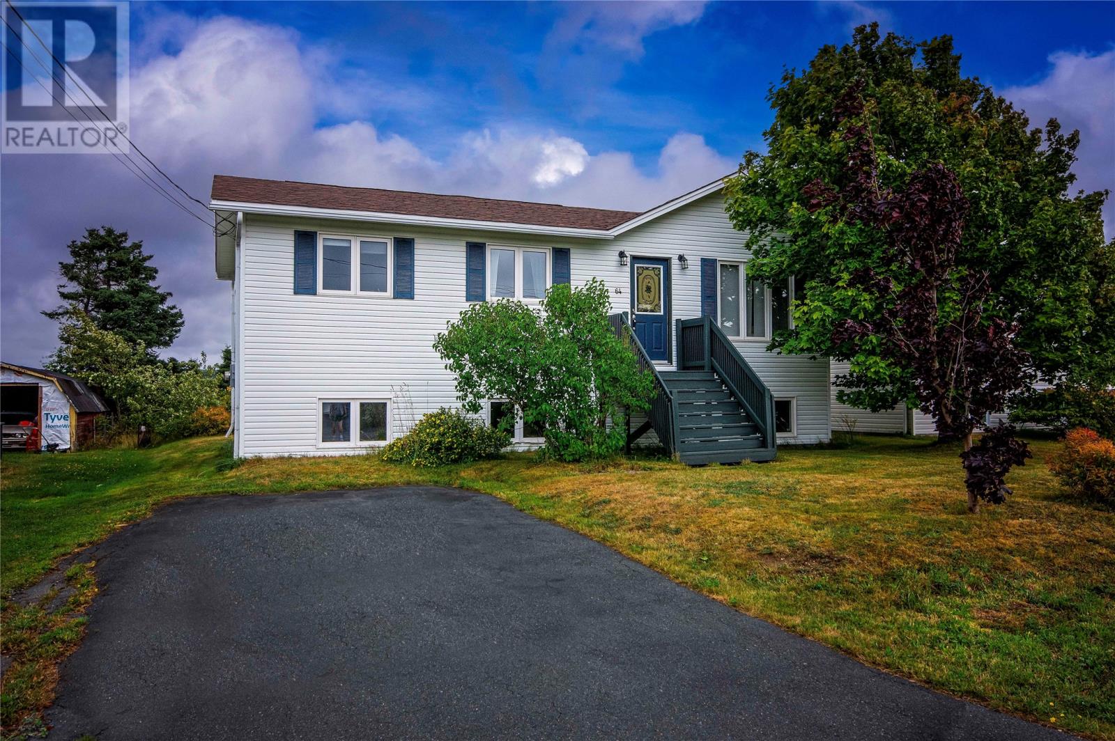 Welcome to 64 Porters Road in sunny Conception Bay South! Tucked away on a quiet street, this home sits on a well-maintained lot with mature trees at the rear for added privacy and features a double paved driveway. Over the past few years, the property has seen numerous upgrades including new shingles, windows, doors, kitchen, flooring, heaters, hot water tank, fresh paint, and more — making it truly move-in ready. Inside, the porch leads into the main living area, where a bright living room flows into the kitchen complete with beautiful cabinetry and stainless steel appliances. The main floor offers three comfortable bedrooms along with a refreshed 4-piece bathroom featuring a new vanity, modern fixtures, and updated flooring. Off the kitchen, step out onto a large deck overlooking the private backyard — perfect for summer entertaining. The fully renovated basement adds exceptional living space with a massive rec room complete with bar and propane fireplace,  a fourth bedroom, half bath, laundry area, storage, and a convenient mudroom with walkout access to the backyard. With its many upgrades, functional layout, and attractive price point, this home is an excellent opportunity for first-time buyers, growing families, or those looking to downsize without compromise. (id:48254)