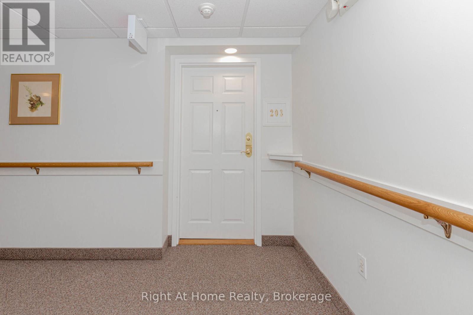 203 - 137 Martin Street, Milton, Ontario  L9T 5H4 - Photo 3 - W12393095