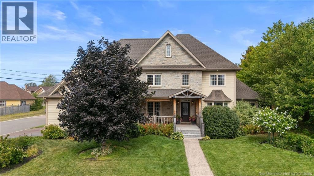 Welcome to 53 Gillespie Street in Dieppe! This exceptional two-storey home with an in-law suite sits on a desirable corner lot near the Petitcodiac River. From first glance, the curb appeal shines with a new front porch and beautiful landscaping. Inside, the main level offers a warm living room with hardwood floors and a propane fireplace with wood storage niches. The recently renovated open kitchen features quartz countertops, a large island, walk-in pantry with sliding barn doors, propane stove, and a shiplap range hood that ties into the white and natural wood design. The dining area includes floor-to-ceiling windows, a coffee bar with wine fridge, and access to the backyard. A cozy 3-season sunroom, half bath, and office complete the main level. Upstairs, the large primary suite boasts a luxurious 5-piece ensuite with double vanity, soaker tub, tiled shower with two detachable heads and a rain shower, plus a spacious walk-in closet. Four additional bedrooms and a 5-piece bath with laundry area finish off the upper floor. The lower level offers a non-conforming bedroom currently used as a gym, and a separate in-law suite with a full kitchen, living room with electric fireplace, bedroom, full bath, and laundry. The private, fully fenced backyard is an absolute oasis with a stamped concrete patio surrounding an in-ground pool, hot tub, gazebo, and 12x16 storage shed. An attached triple car garage (extended in 2020) and a new ducted heat pump (2024) complete this dream home!! (id:48254)