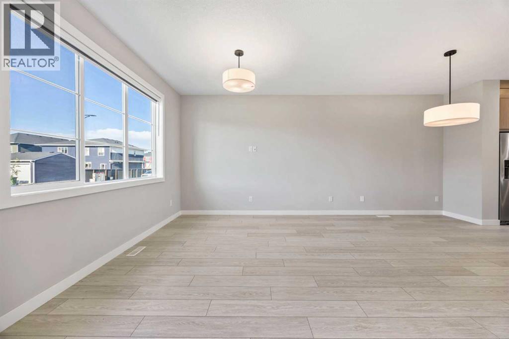 204 Chelsea Manor, Chestermere, Alberta  T1X 2P5 - Photo 4 - A2250648