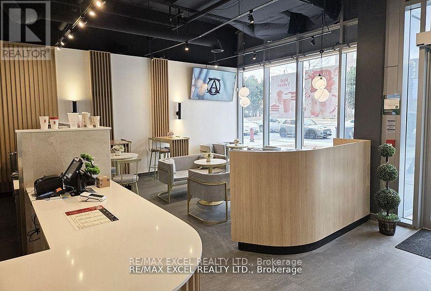103 - 9471 Yonge Street, Richmond Hill, Ontario  L4C 0Z5 - Photo 1 - N12397918