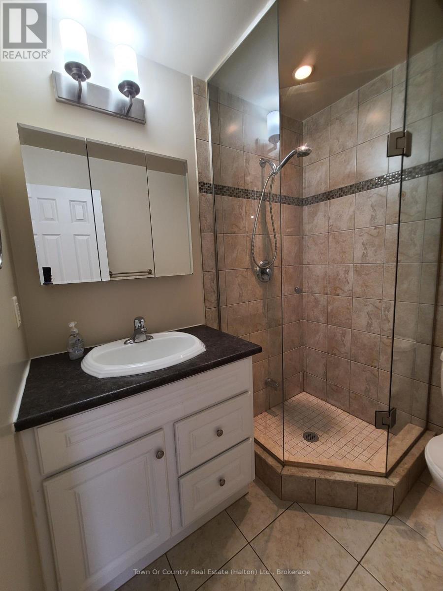 101 - 158 Mill Street, Milton, Ontario  L9T 1S2 - Photo 5 - W12398746