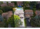 Aerial view of residential area featuring a pool
