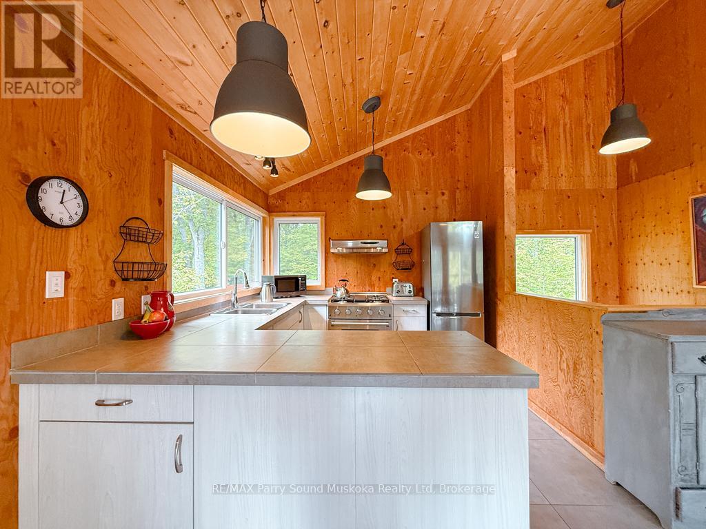 71 Crown Retreats Road, Whitestone, Ontario  P0A 1G0 - Photo 6 - X12401331