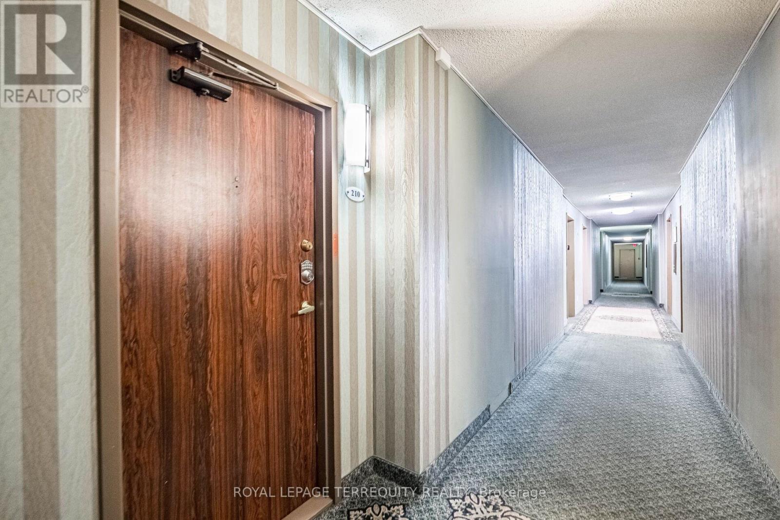 210 - 299 Mill Road, Toronto, Ontario  M9C 4V9 - Photo 4 - W12403020