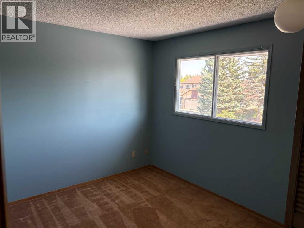 256 Woodstock Place Sw, Calgary, Alberta  T2W 5W4 - Photo 11 - A2251615