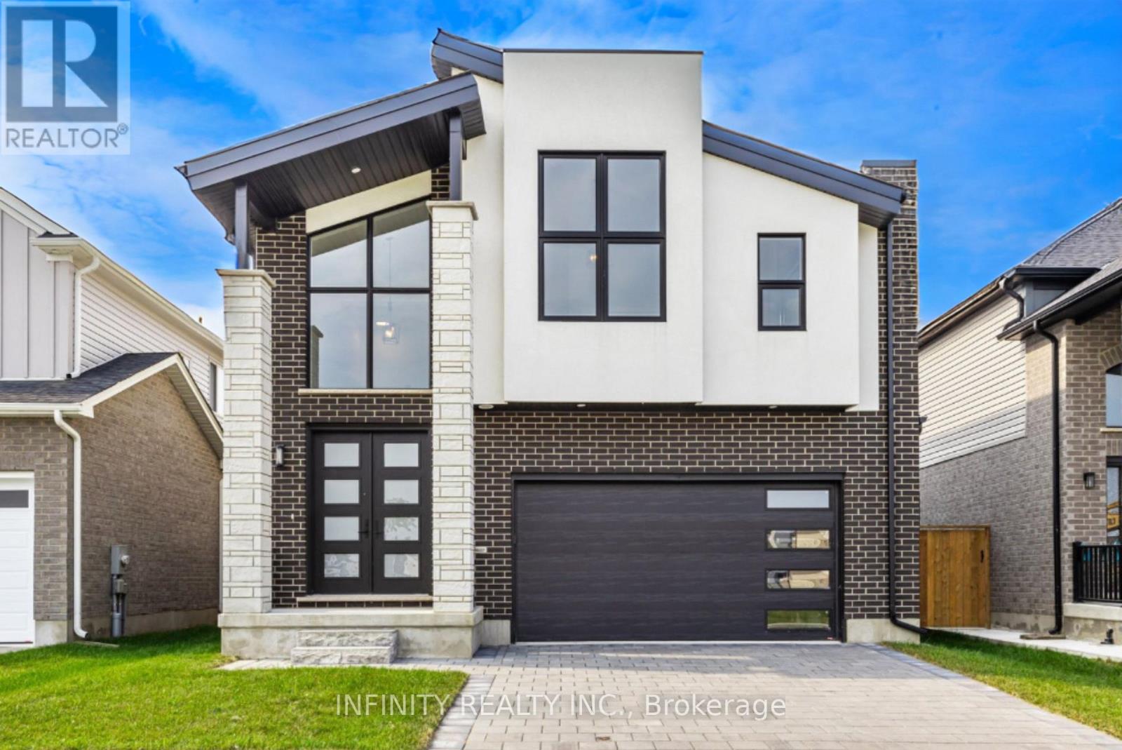 Step into luxury and contemporary elegance with this stunning 2 storey home located in prestigious Kilworth. This LIKE NEW 4 Bed, 4 Bath exquisite residence is the epitome of modern living. Sprawling across 3,953 sq ft including 2784 sq ft above grade finished space and with a 5 year Tarion New Home Warranty still remaining for your ultimate peace of mind. As you step inside, you are greeted by a grand foyer featuring soaring ceilings & a sweeping staircase that sets the tone for the elegance that flows throughout the home. The spectacular main level boasts an open concept design, drenched in natural light from floor-to-ceiling windows, with rich hardwood floors. The living room, complete with a gas fireplace, seamlessly connects to the dining area, perfect for entertaining.The stylish, modern gourmet kitchen is a chef's dream, adorned with quartz countertops, a large island & a pantry for ample storage. Adjacent to the kitchen is a breakfast area with patio doors that open to a large, fully fenced yard. Convenience is key with a main level mud room with laundry situated just off the kitchen & a 2pc Bath for guests. Upstairs, the bright & spacious primary bedroom is a serene retreat, featuring vaulted ceilings, a large walk-in closet & a spa-like 5pc ensuite bath with dbl sinks, a soaker tub & glass shower. The second floor also includes 3 additional generously sized bedrooms, a 4pc Jack & Jill bath with dbl sinks, glass shower & another full 4pc bath, ensuring ample space and privacy for the whole family. This home comes with a 2 car attached garage & is situated in a fantastic neighborhood near schools, golf courses, YMCA, Komoka provincial park, walking trails, playgrounds, hockey arena, shopping & more. Sq Ft as per iguide. Don't miss the opportunity to make this extraordinary home yours! (id:48254)