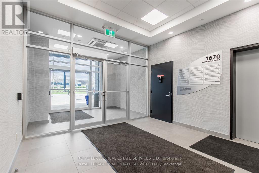 215 - 1670 North Service Road, Oakville (Qe Queen Elizabeth), Ontario  L6H 7G3 - Photo 2 - W12404266