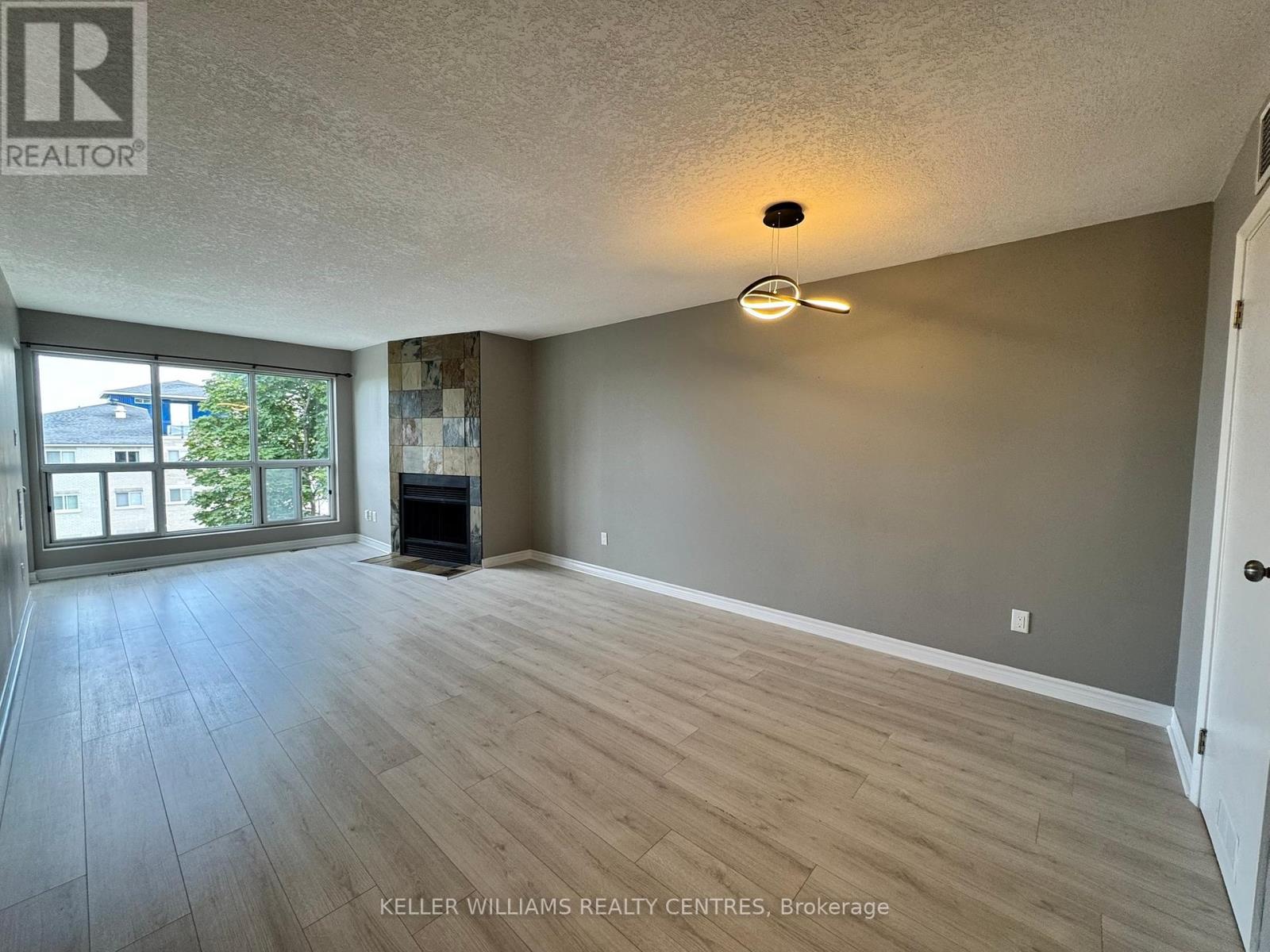 414 - 126 Bell Farm Road, Barrie, Ontario  L4M 6J3 - Photo 2 - S12404613