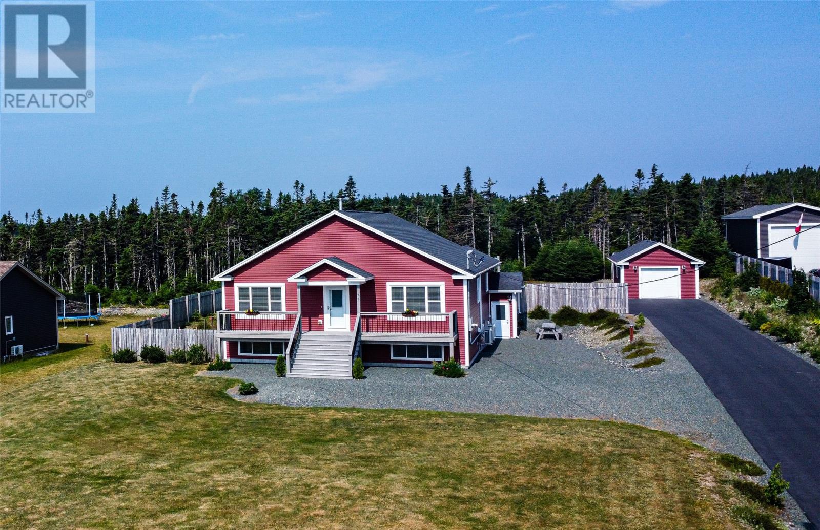 Executive 4 bed, 3 bath home with in-law suite on 1 acre lot! Custom-designed by its original owners this 3538 sqft home has beautiful open concept layout with modern features and ideal for the family looking for extra income or to have your older children or parents have a wonderful space as well. Enjoy abundant natural light through custom oversized windows (complete with custom blinds), gleaming hardwood floors, a gourmet kitchen with amazing storage and an oversized island.  Enjoy ultimate privacy on the rear back deck facing the treed rear gardens. Cozy up by the wood stove during chilly winter evenings, and stay cool and comfortable year-round with a mini split in the main living space and in law suite. The main level offers a luxurious primary suite with a walk-in closet and a spa-inspired ensuite featuring a tiled shower and a corner soaker tub. A generous guest bedroom, full guest bathroom, and main floor laundry complete this level. Downstairs, there is an additional flex space currently used as a bedroom that can be a rec room or home office for the main house.  The fully developed basement has an in-law suite with one bedroom, a full bathroom, a newly installed kitchen, and a spacious rec room—also outfitted with a mini split for efficient climate control. Have piece of mind with the GenerLink hookup too. Outdoors, the fenced backyard is a private oasis complete with vegetable garden boxes, apple trees, and multiple outbuildings including a detached 16x30 wired and insulated garage. Located in a friendly and tight-knit community and quiet cul-de-sac, you'll love having direct access to Voisey’s Brook Park, which offers walking trails, soccer fields, skate park, basketball courts, and more. With top-rated schools and busing right at your doorstep, this home truly has it all. (id:48254)