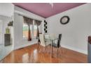 Dining area featuring wood finished floors and baseboards