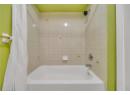 Full bathroom with shower / tub combo with curtain