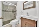 Bathroom with vanity and a shower stall