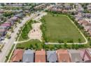 Aerial overview of property's location with nearby suburban area