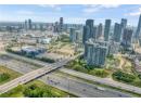 Bird's eye view of a major roadway and skyline