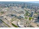 Aerial view of property and surrounding area with nearby urban area