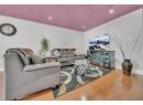 Living room with wood finished floors and recessed lighting