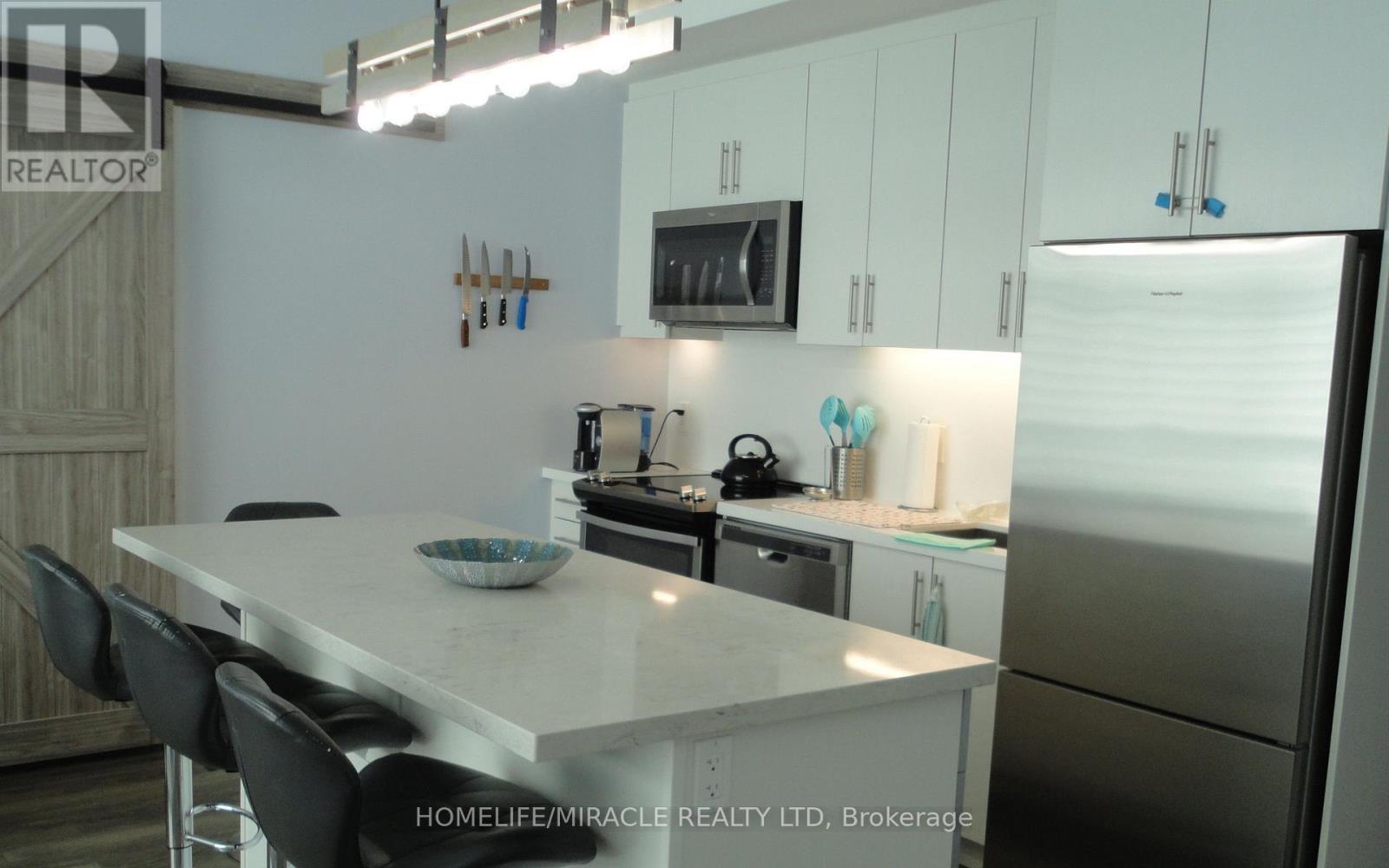 C410 - 301 Sea Ray Avenue, Innisfil, Ontario  L9S 2P7 - Photo 4 - N12407961