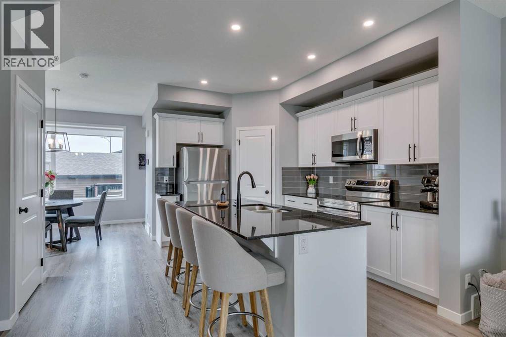 63 Wolf Gate, Okotoks, Alberta  T1S 5T9 - Photo 4 - A2255196