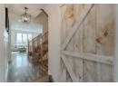 Stairs featuring wood finished floors and recessed lighting