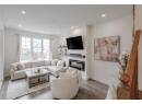 Living room with wood finished floors and recessed lighting