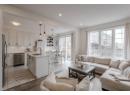 Living area featuring recessed lighting and light tile patterned floors