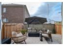 Fenced backyard featuring outdoor lounge area