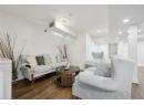 Living room with dark wood finished floors and recessed lighting
