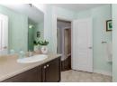 Bathroom with vanity and light tile patterned floors